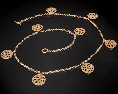 <p>Collana in oro con catene e medaglioni traforati tondi</p>